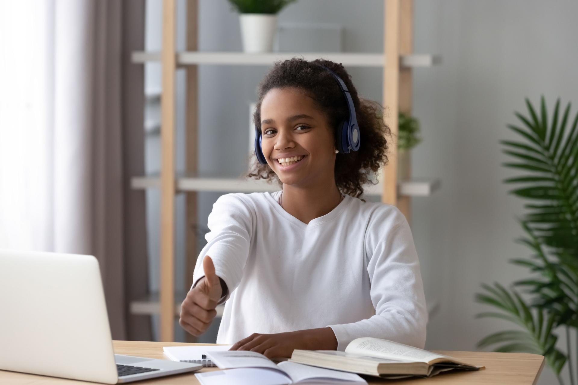 Happy black teenager recommend online study course